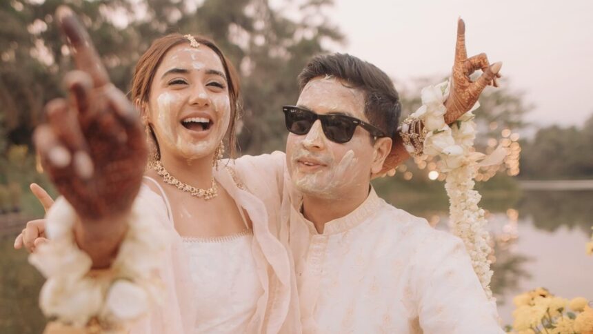 Prajakta Koli sits on fiance Vrishank Khanal's lap, caresses him during their white-themed haldi ceremony. See pics